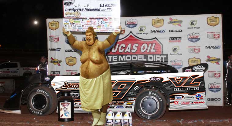 VLR_LP poses in victory lane after winning at Outlaw!